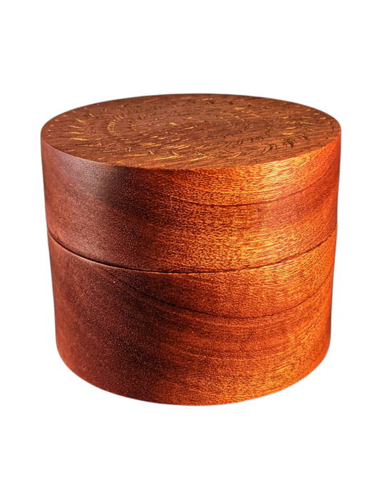 Lidded sapele box with gilded decorative trim